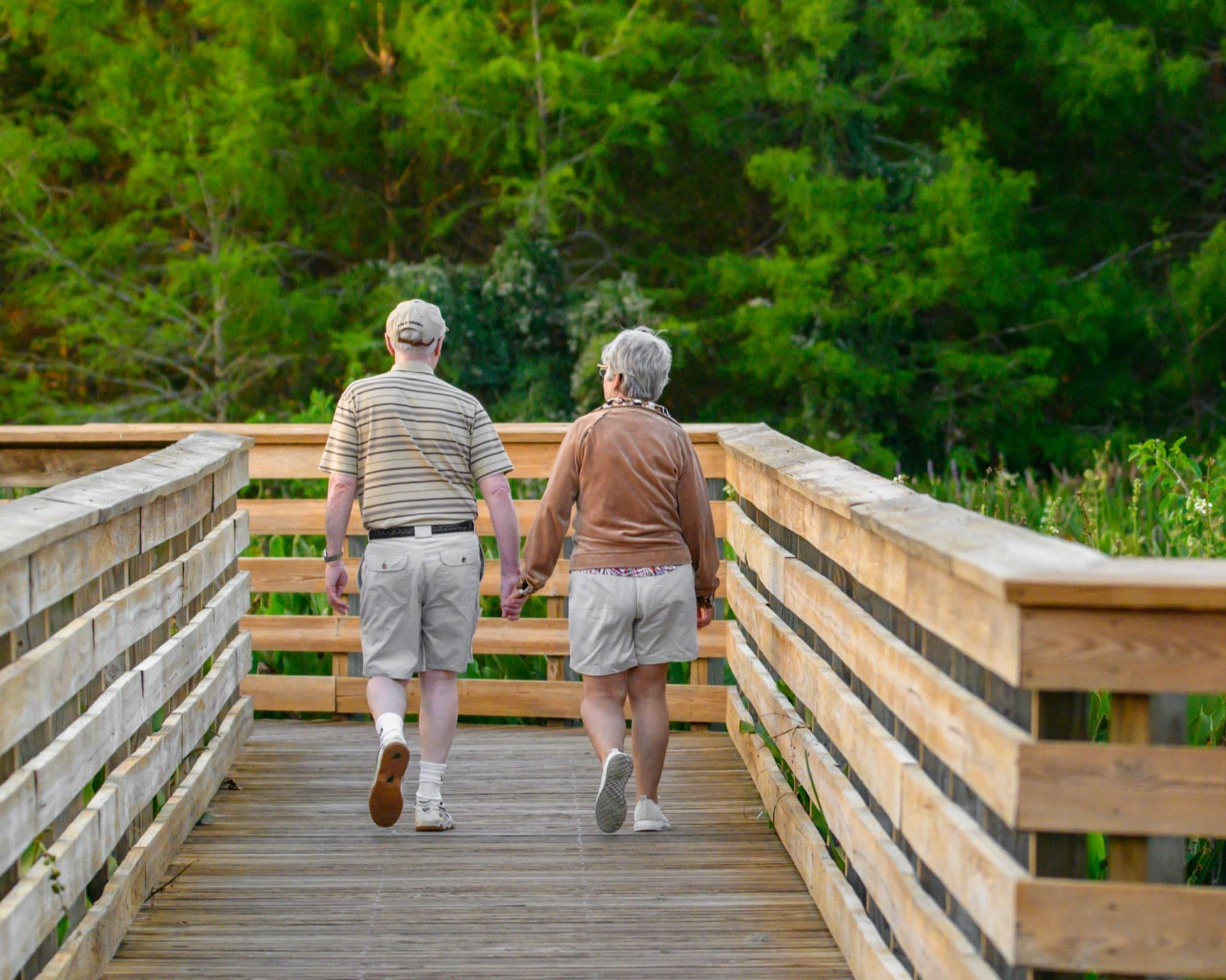 Senior couple walking on a boardwalk