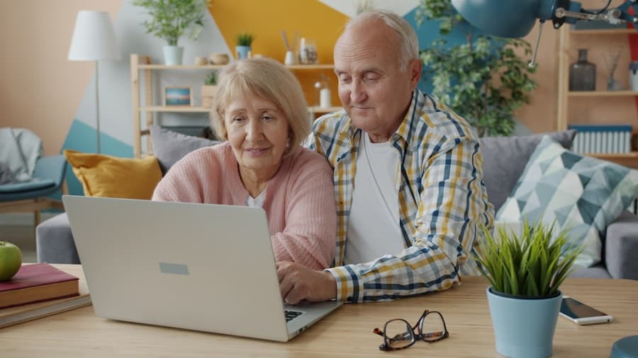 Senior couple using a laptop together