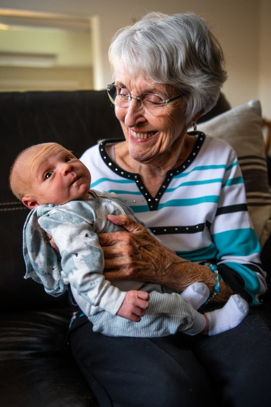 Grandmother holding a baby grandchild